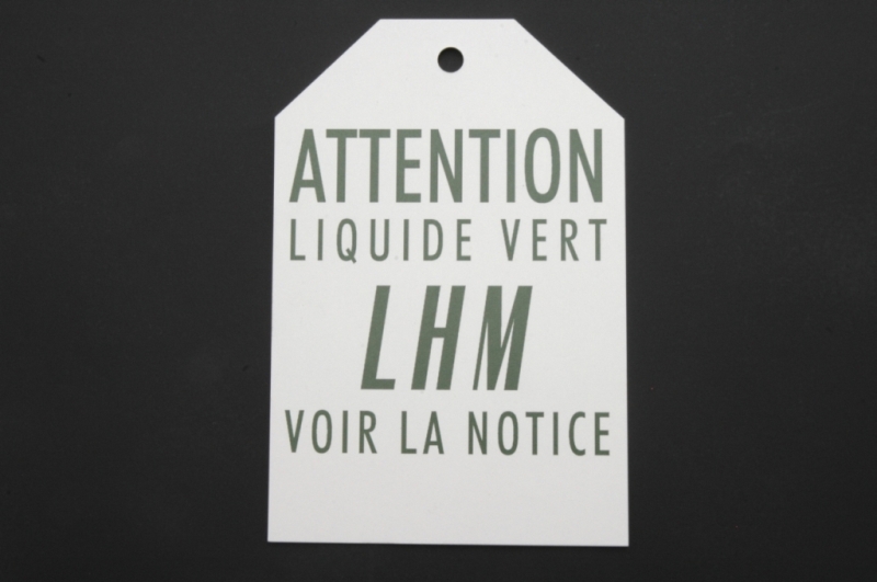 Kaart: Attention liquide vert LHM voir la notice.